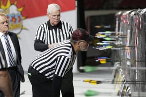 Judges carefully evaluate a scoring end at The Vegas Shoot.